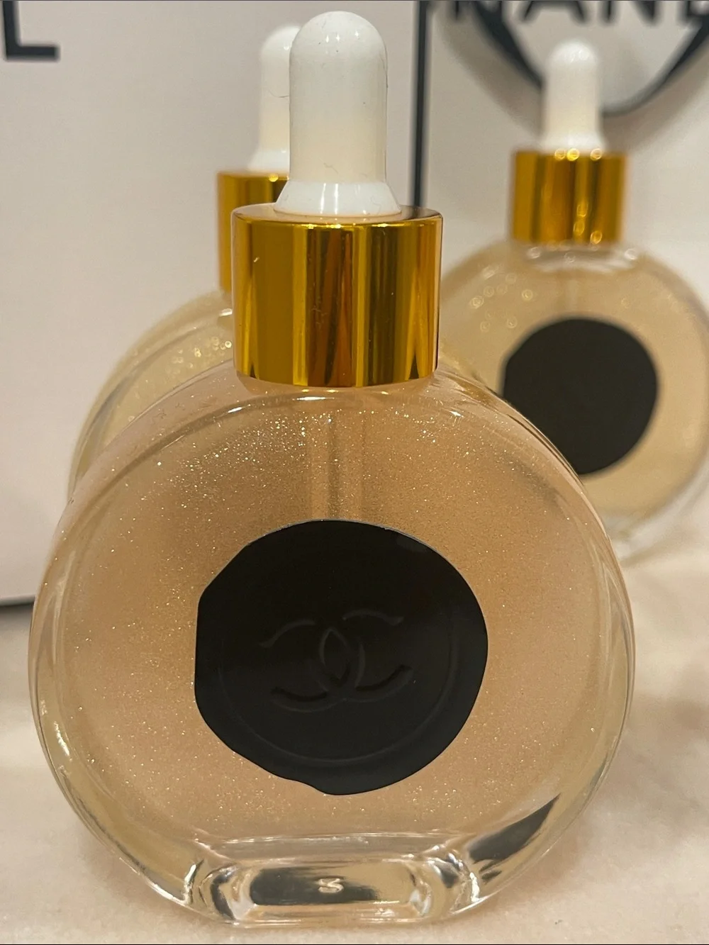 CHANEL Illuminating Shimmering Body Oil Fragrance Drop Bottles.
